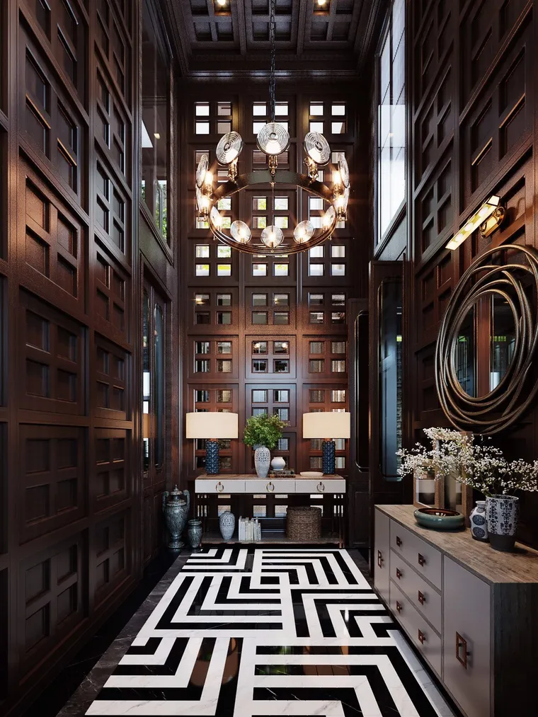 Double-height entry hall with carved timber screens and a black-and-white maze floor
