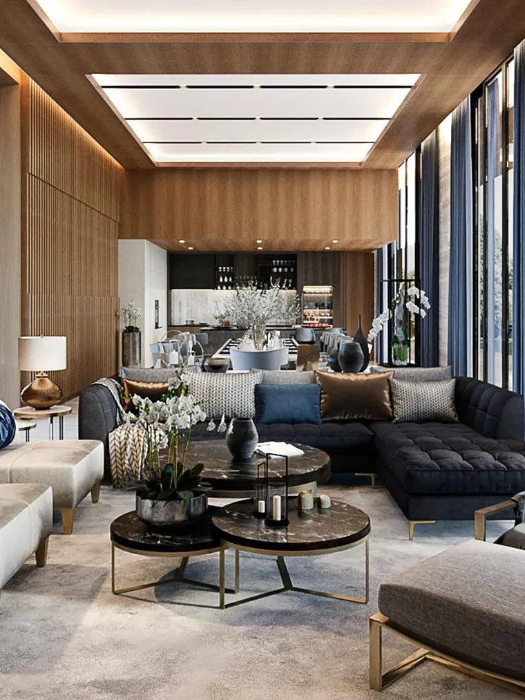 Double-height living room with timber slat walls and a black tufted sofa