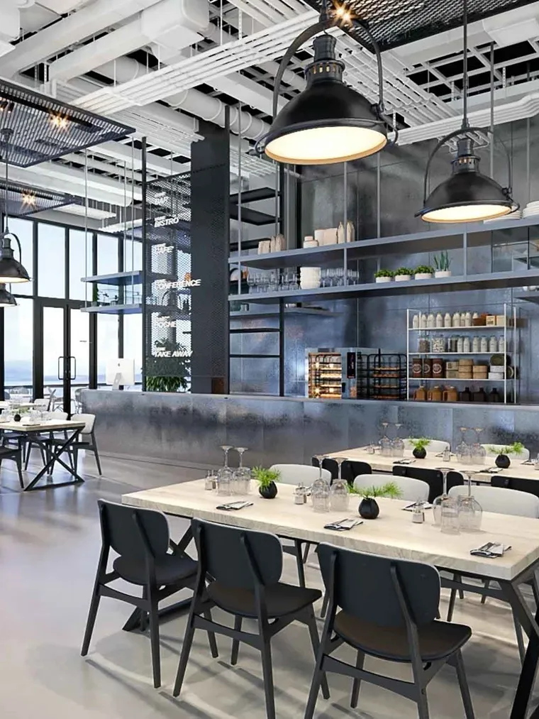Industrial staff café with steel counter and black pendant lamps